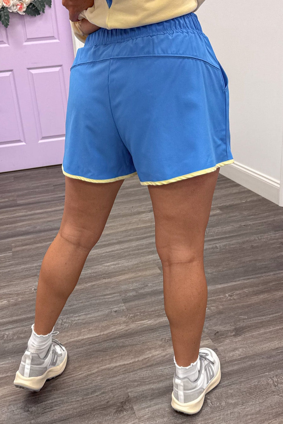 blue with butter yellow trim details wide leg lightweight fabric athletic shorts