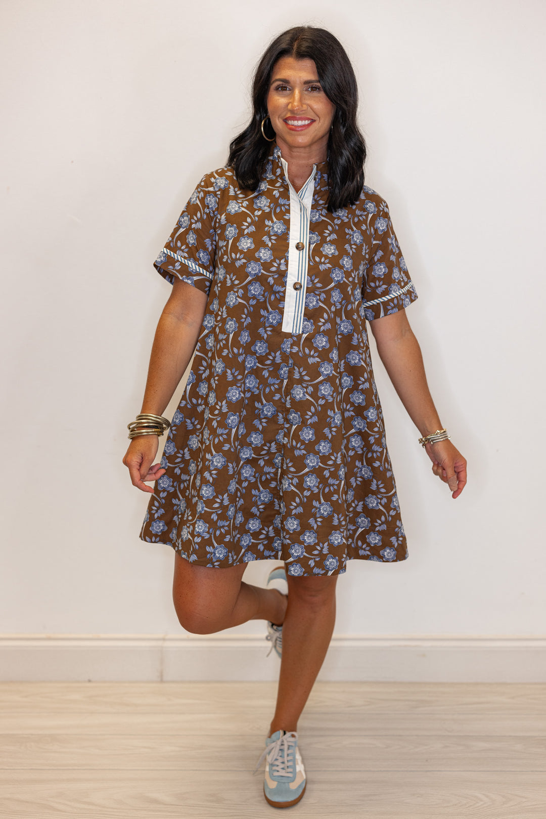 Women's brown dress with blue floral print and striped trim by Entro showing full front view