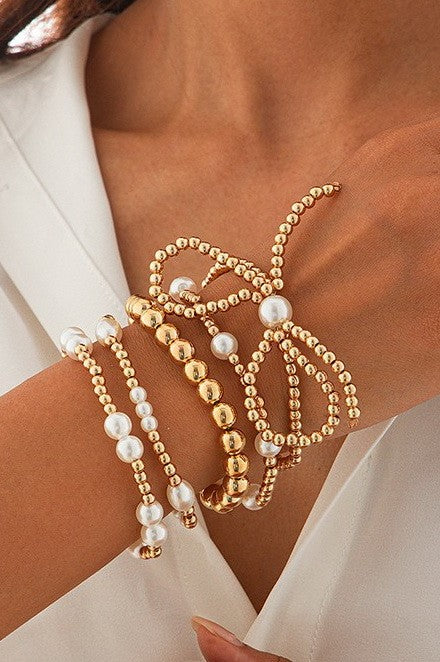 pearl bow beaded bracelet set on model
