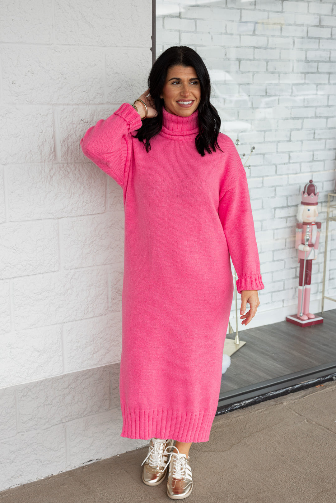 Women's pink knit long sleeve turtleneck midi sweater dress by GeeGee showing full front view