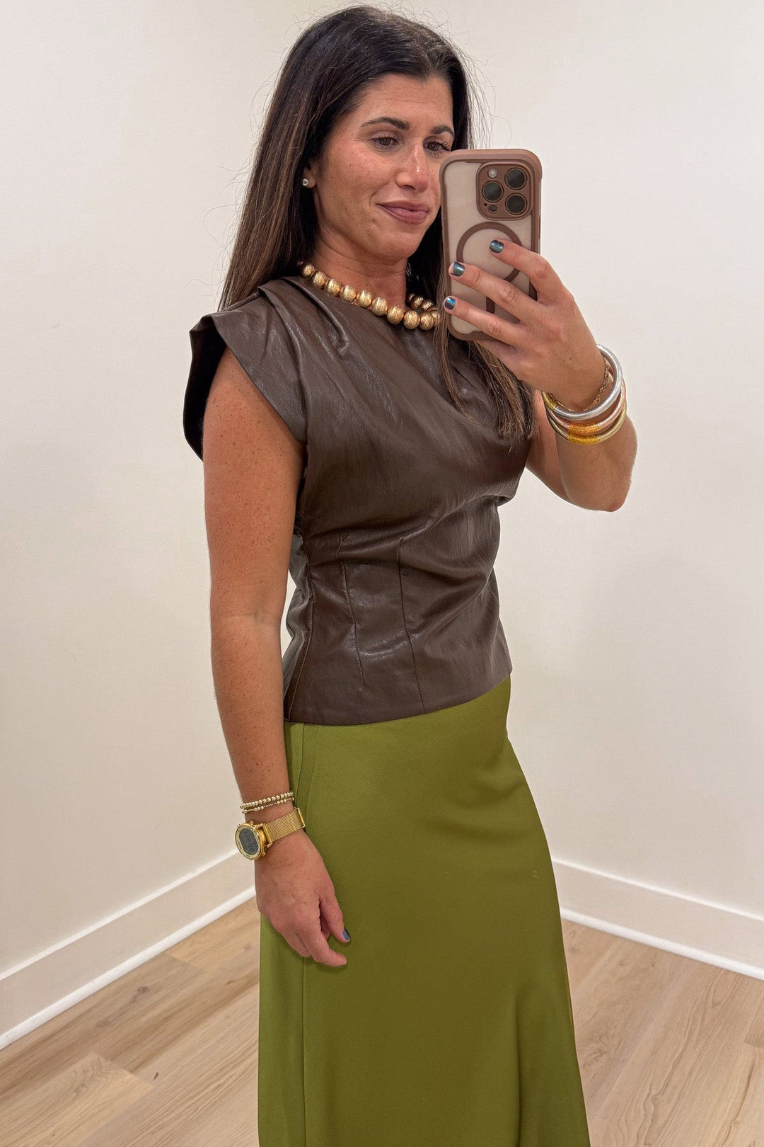 solid brown dolman cap sleeve crew neckline faux leather top with ruched shoulder details