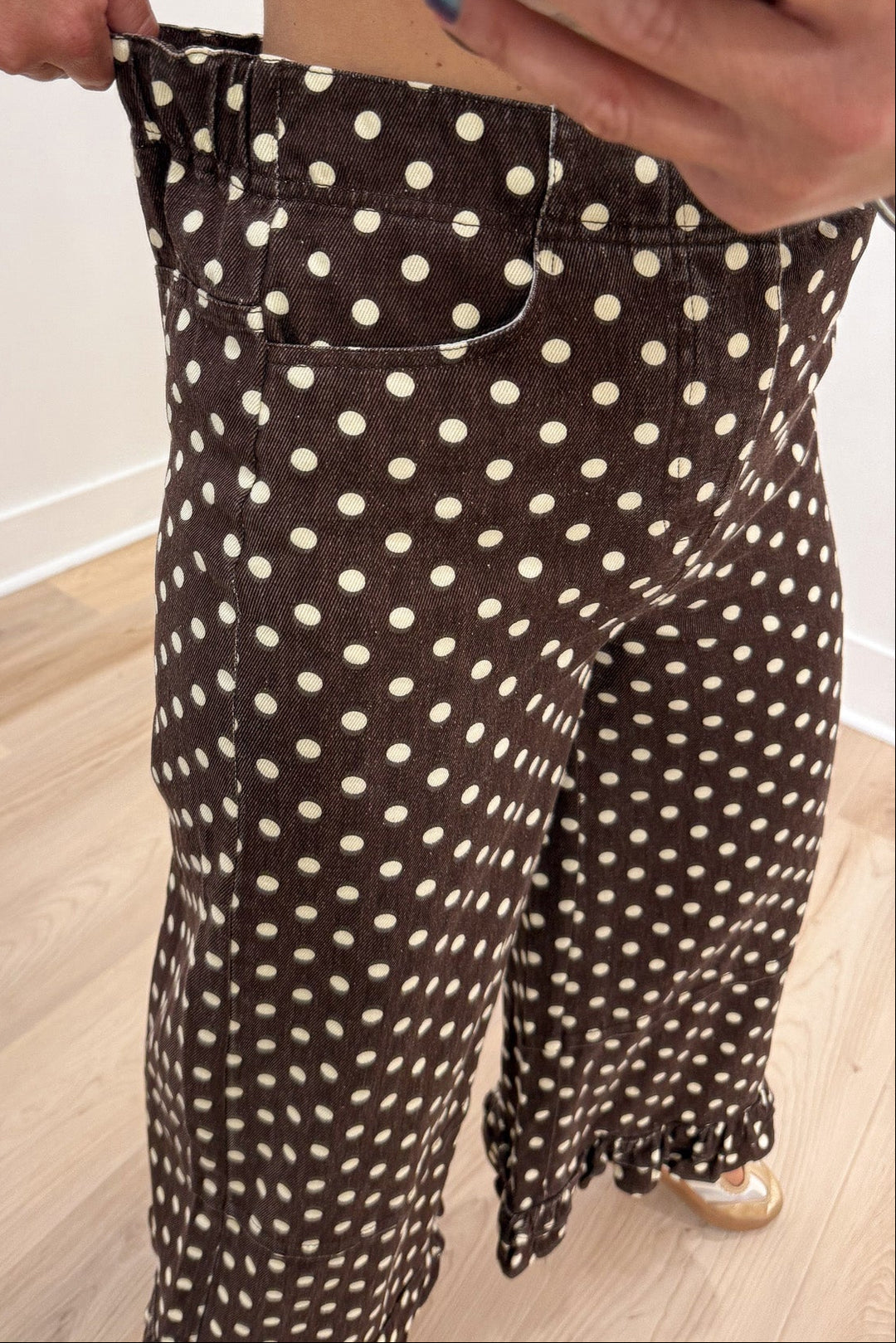 brown with cream polka dot print ruffled hem wide leg cropped twill denim pants with button fly closure