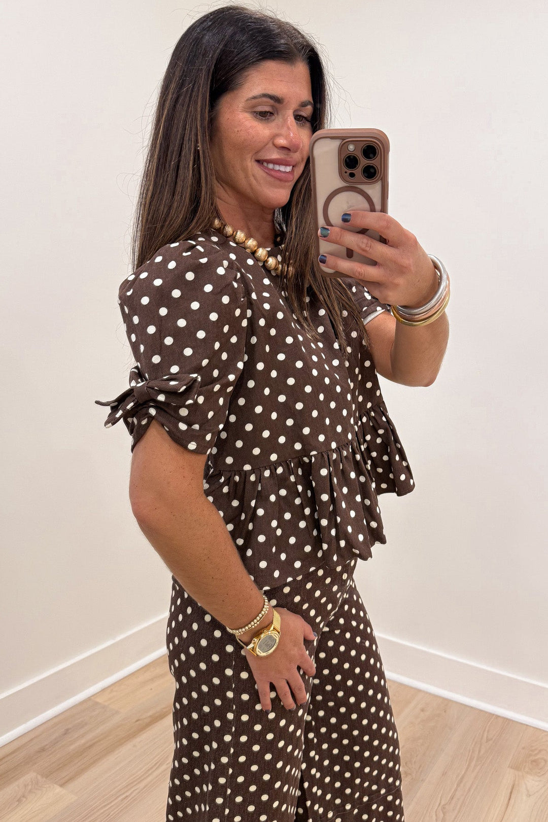brown with cream polka dot print short puff sleeve semi-cropped peplum style denim twill top