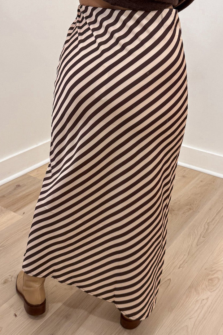brown and cream asymmetrical diagonal striped lightweight satin midi skirt back view
