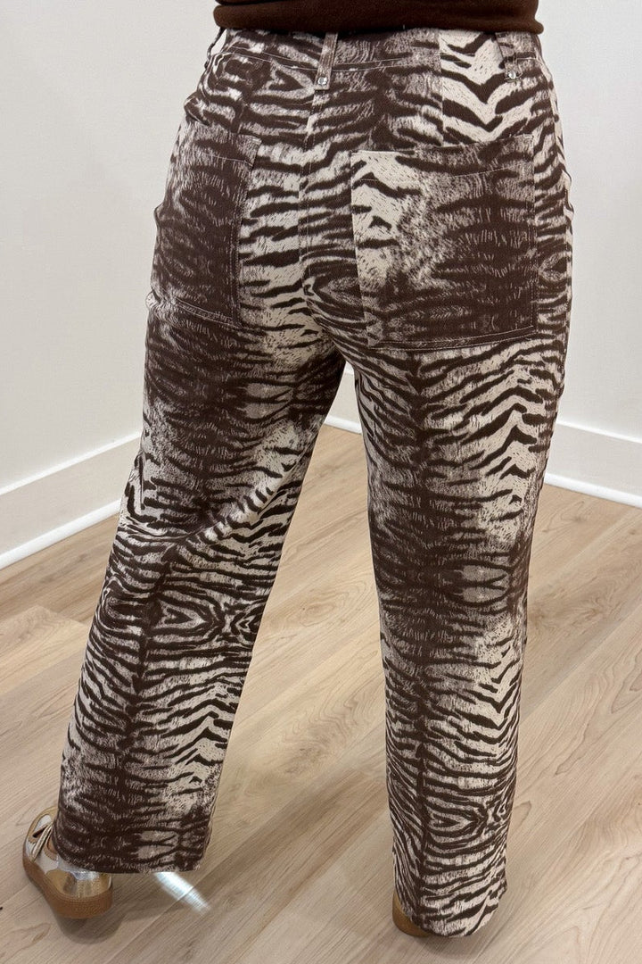 brown and cream zebra print wide leg twill denim pants with pintuck details and back pockets