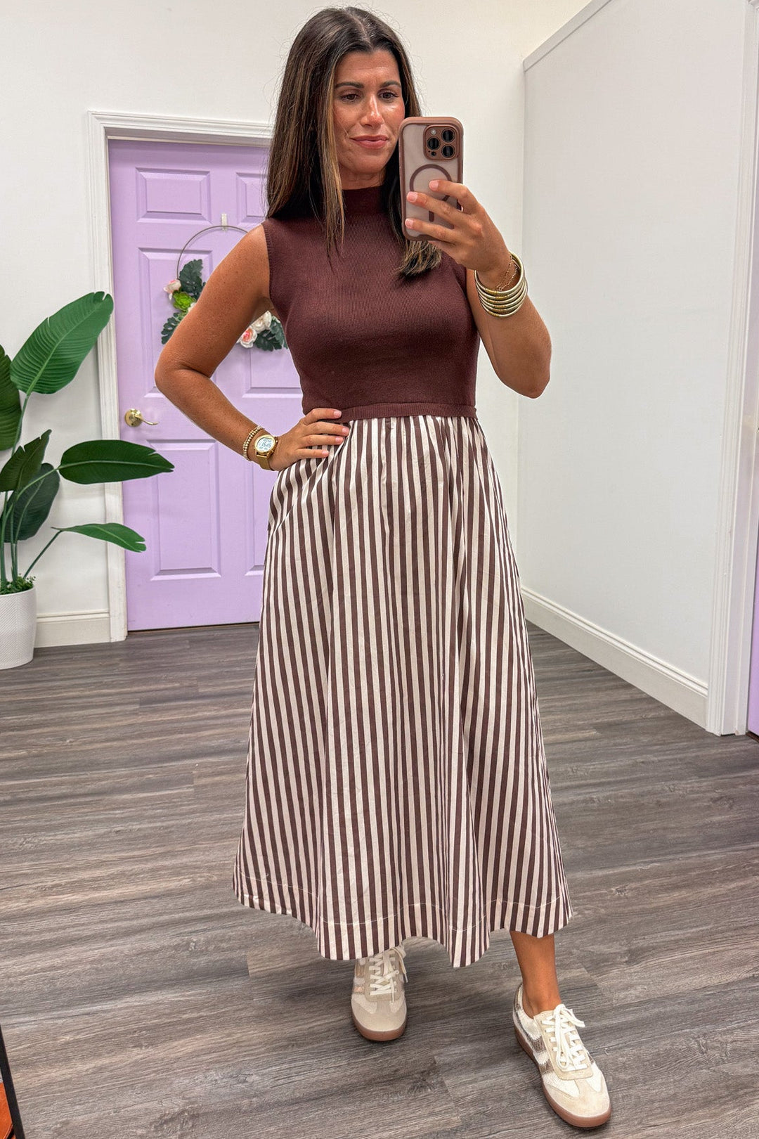 brown and ecru midi dress with sleeveless sweater top and striped woven skirt
