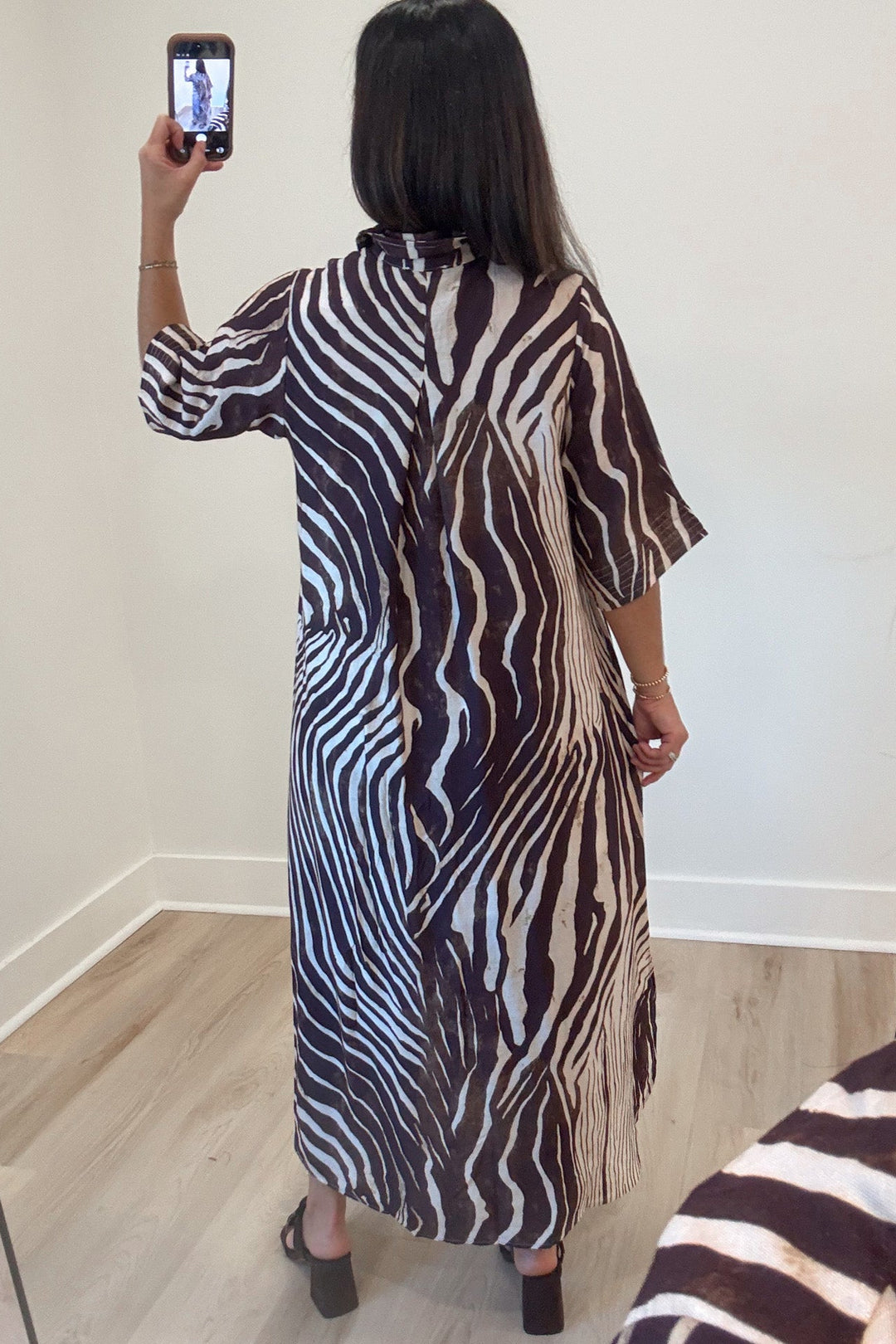 brown and ecru abstract zebra print half sleeve button front bodice midi dress with rounded bottom hem