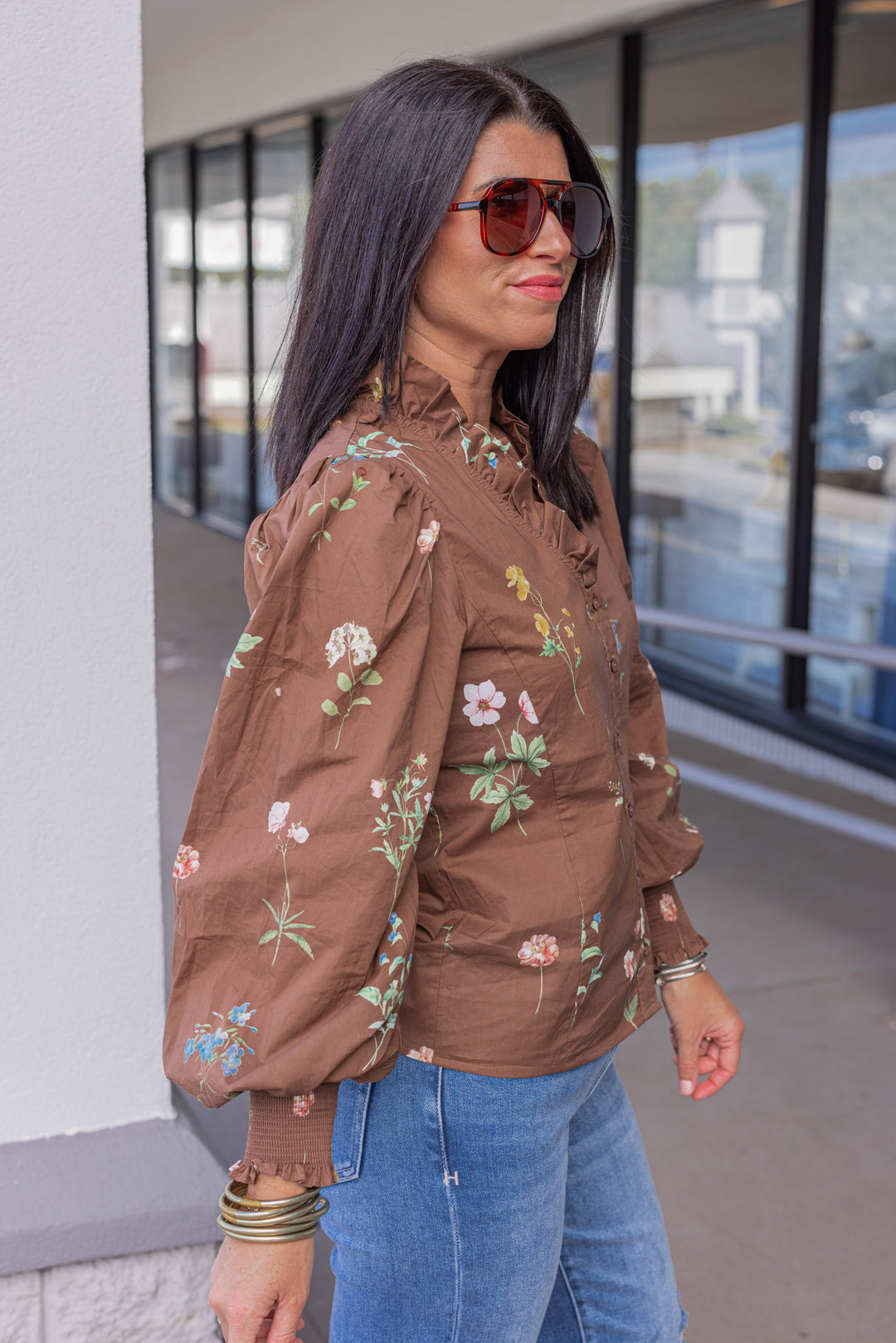 Women's brown multicolor floral print button front poplin top by Entro showing side view