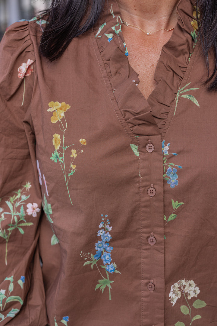 Women's brown multicolor floral print poplin top by Entro showing up close look at floral print and button front closures