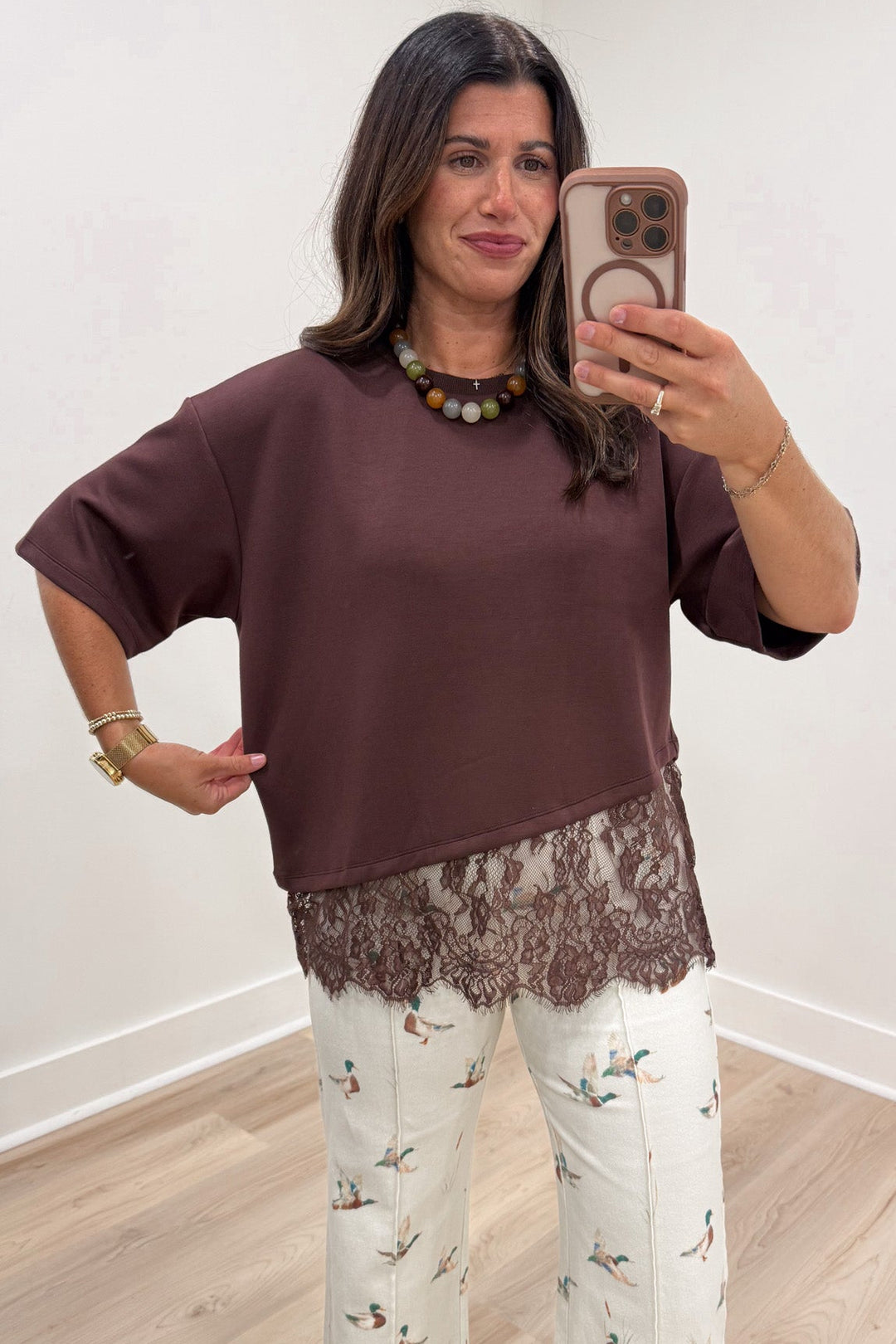 solid brown asymmetrical tiered lace hem short sleeve crew neckline relaxed fit top