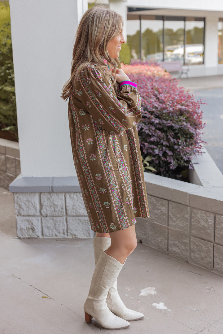 Women's brown olive babydoll dress with floral trellis print and hot pink trim by Jodifl showing full side view