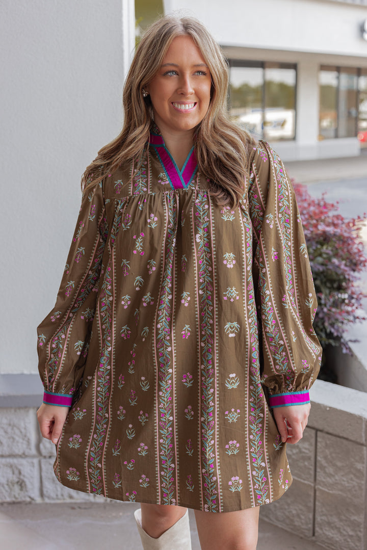 Women's brown olive babydoll dress with floral trellis print and hot pink trim by Jodifl showing up close front view