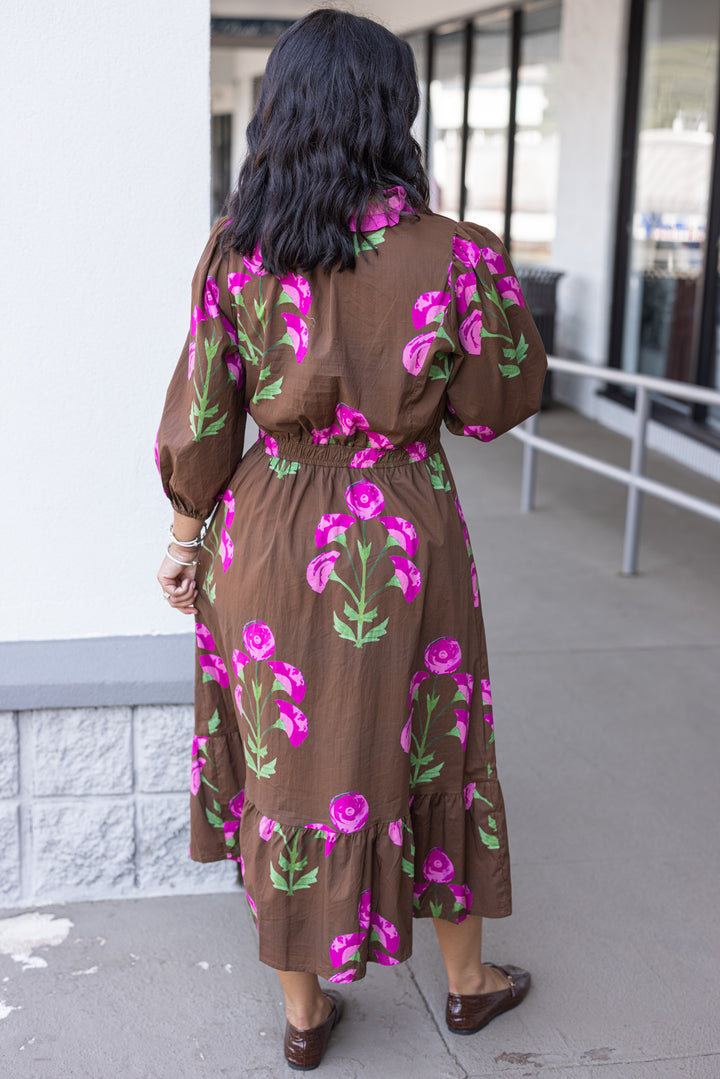Women's brown midi dress with pink and green florals and pink ruffle trim by Umgee showing full back view
