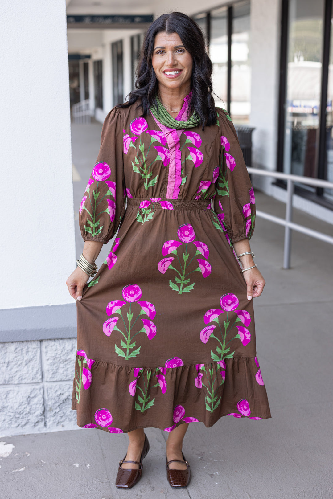 Women's brown midi dress with pink and green florals and pink ruffle trim by Umgee showing full front view