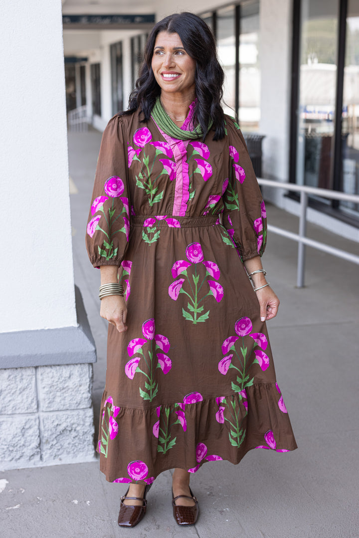 Women's brown midi dress with pink and green florals and pink ruffle trim by Umgee