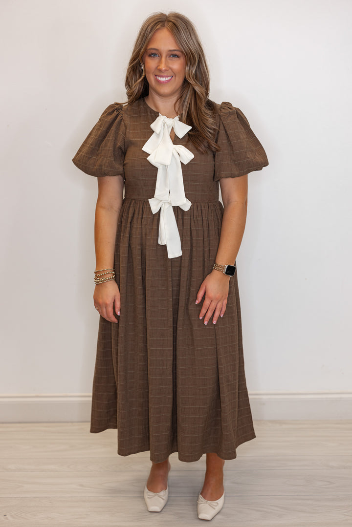 Women's brown check-textured monochrome midi dress with cream bows by In February showing full front view