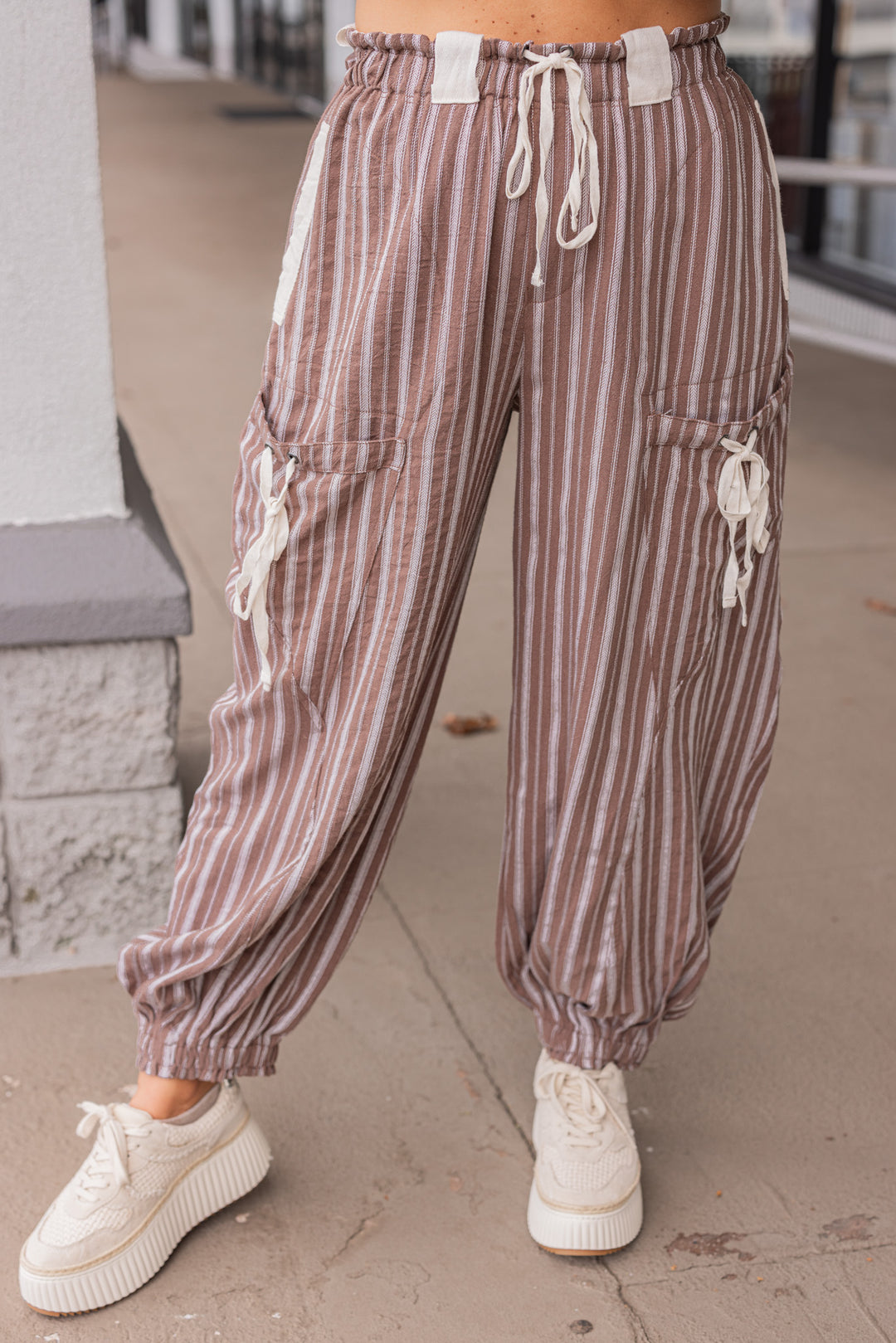 Women's milk chocolate brown linen cargo jogger pants with cream stripes by ee:some