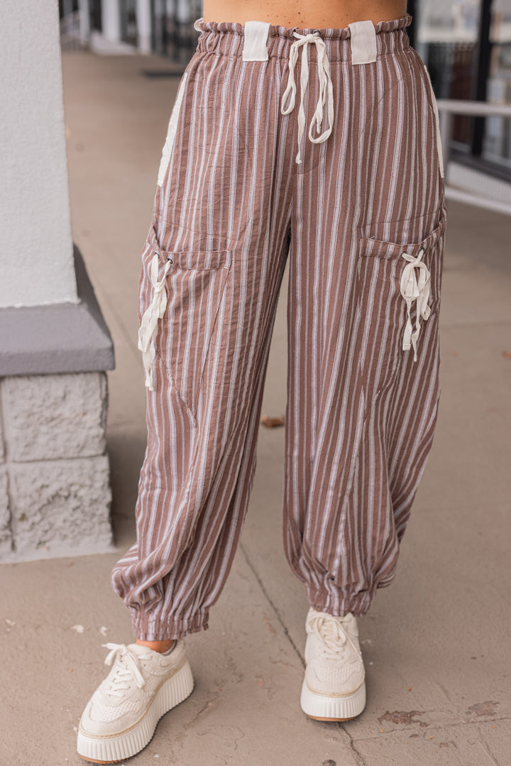 Women's milk chocolate brown linen cargo jogger pants with cream stripes by ee:some showing up close front view