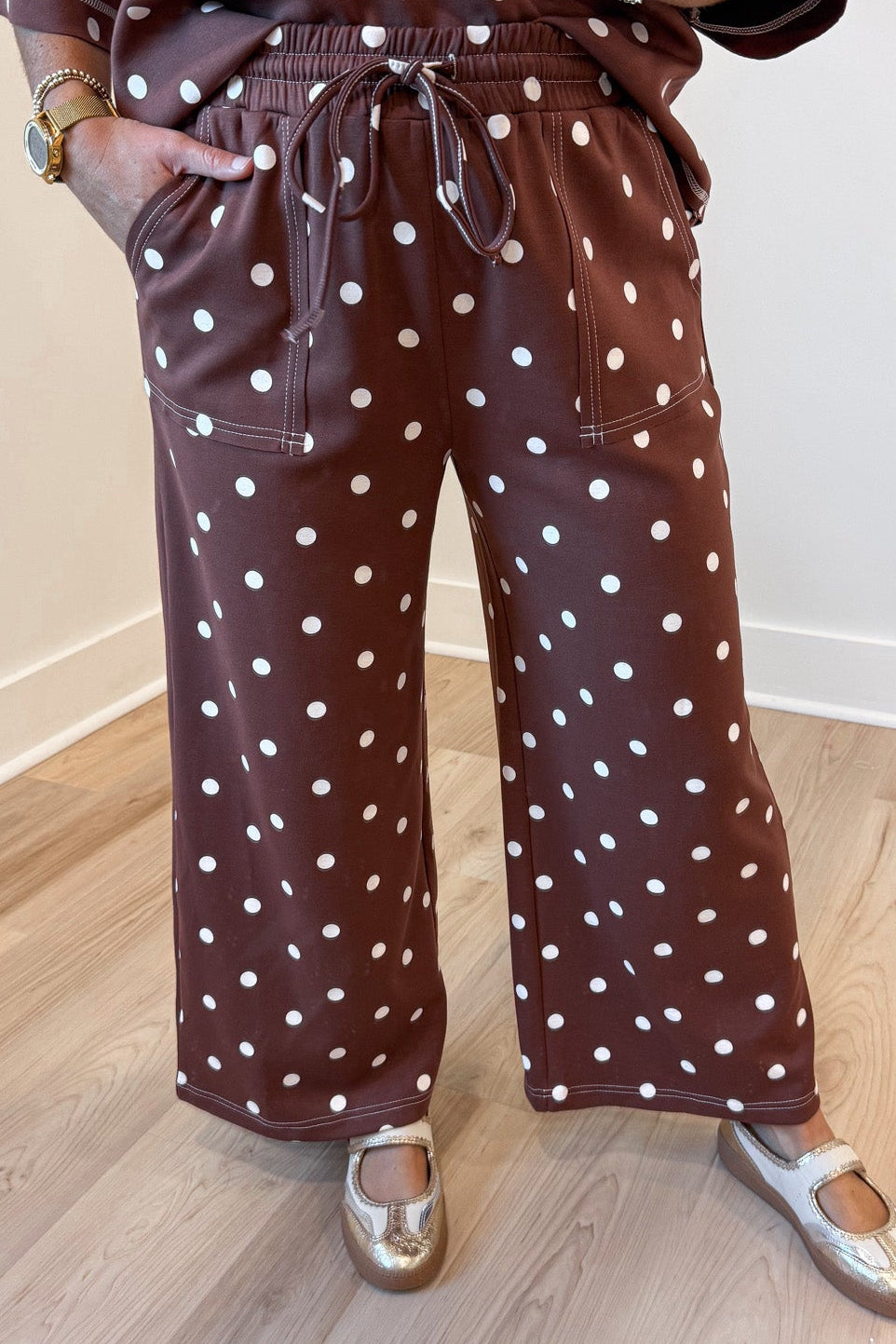 chocolate brown with white polka dot print top and wide leg pants matching knit set