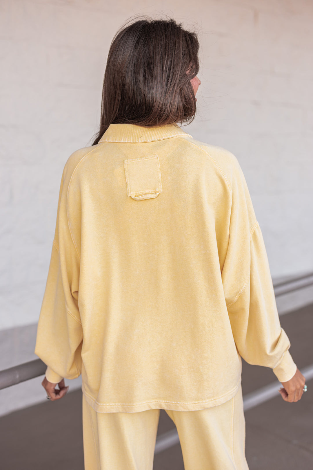 butter yellow button neckline pullover top back view
