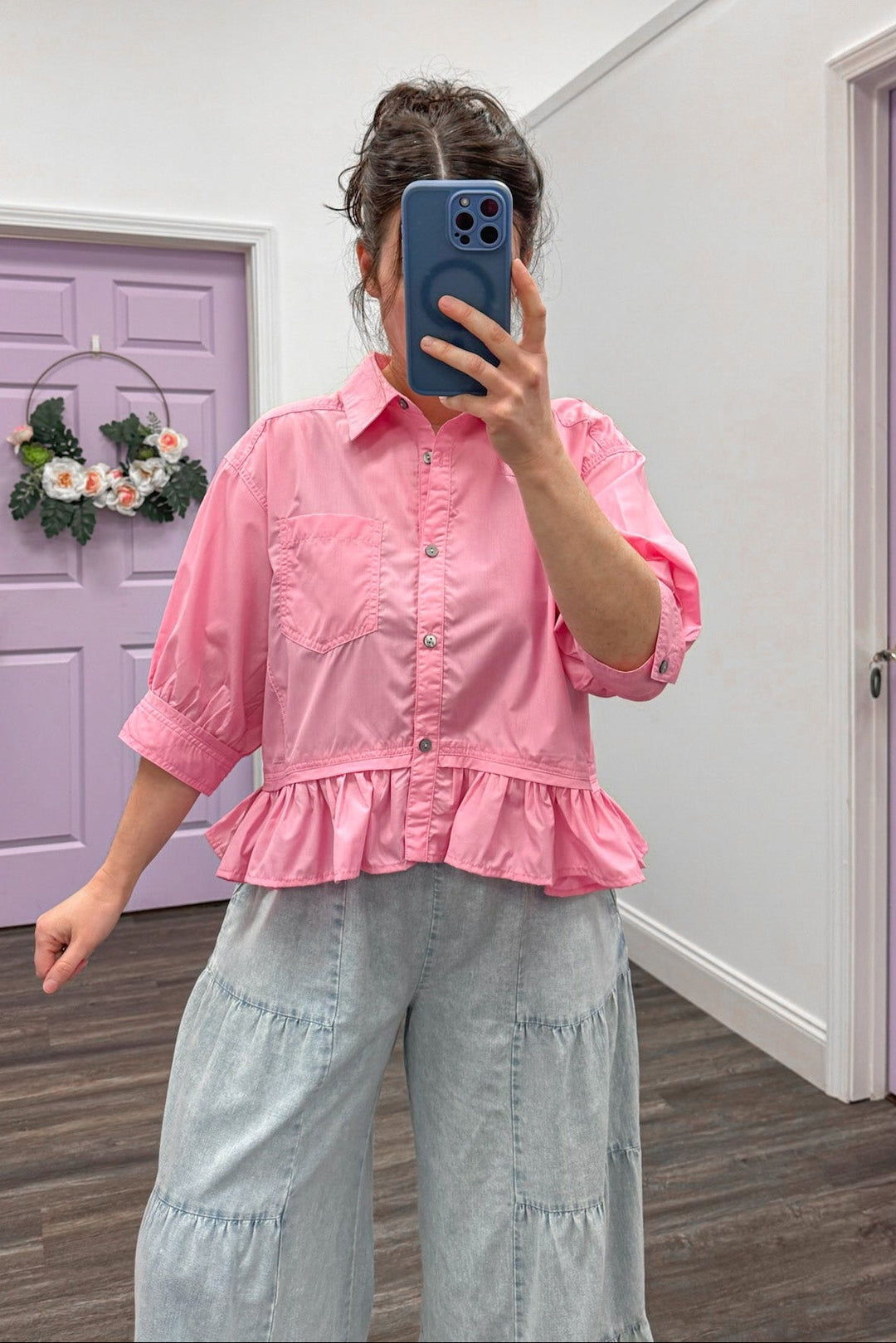 Women's button down pink peplum top with ruffled hem by Entro, great for Spring weather