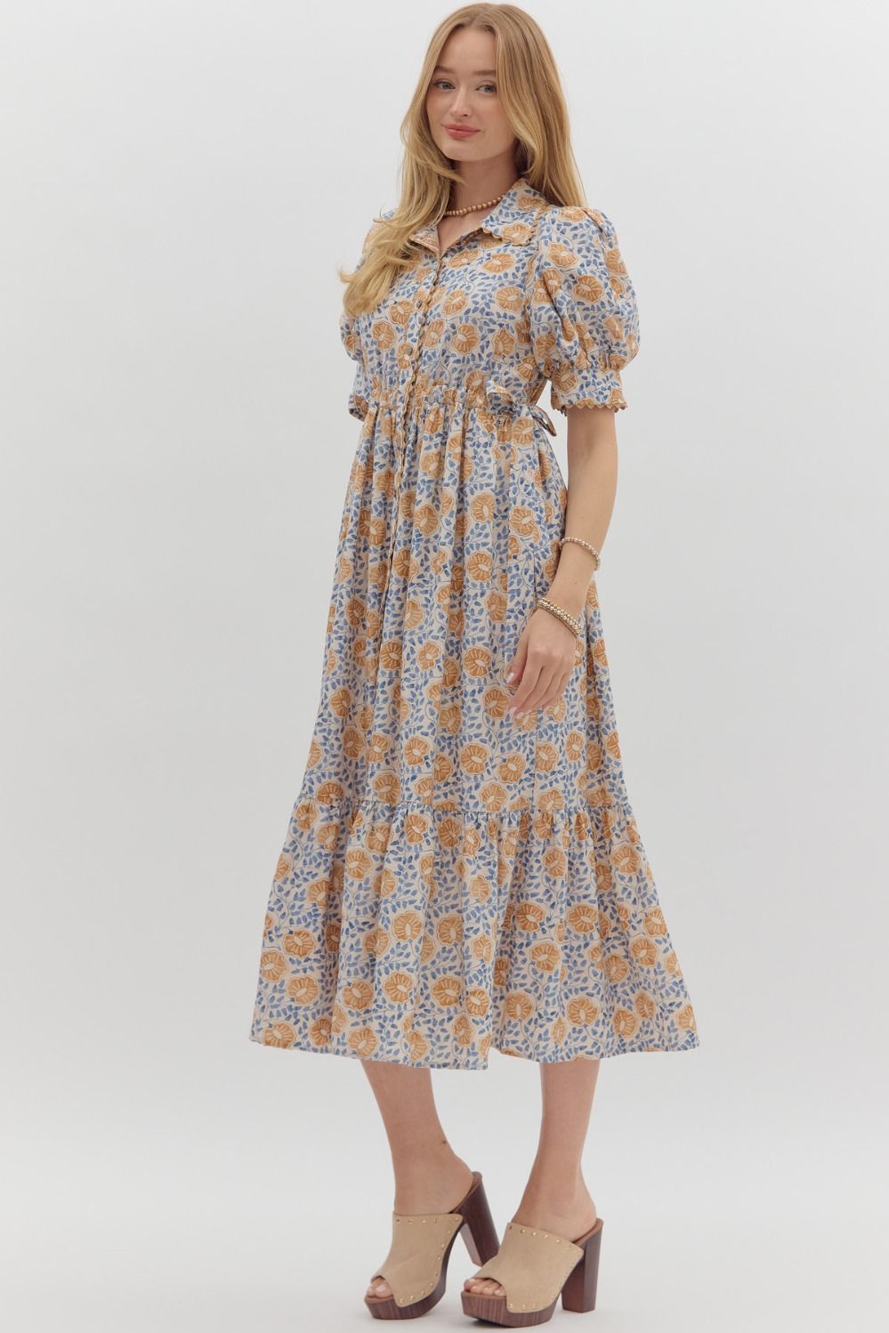 Women's cream button front midi dress with caramel and blue floral print by Entro showing skirts relaxed silouhette