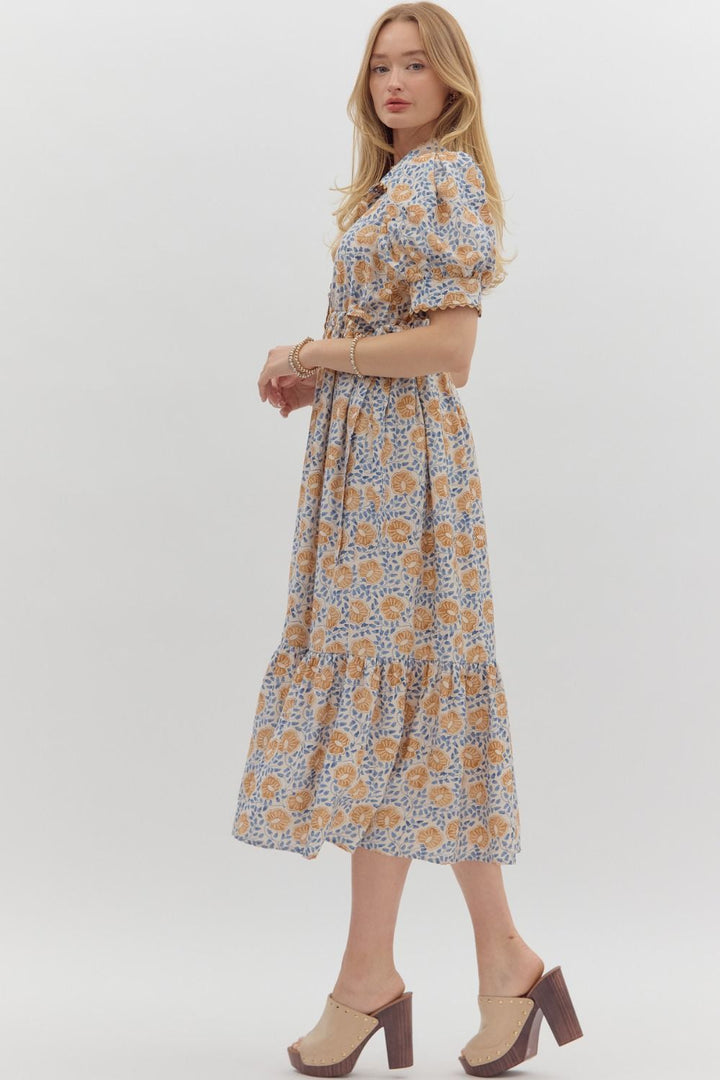 Women's cream button front midi dress with caramel and blue floral print by Entro showing full side view
