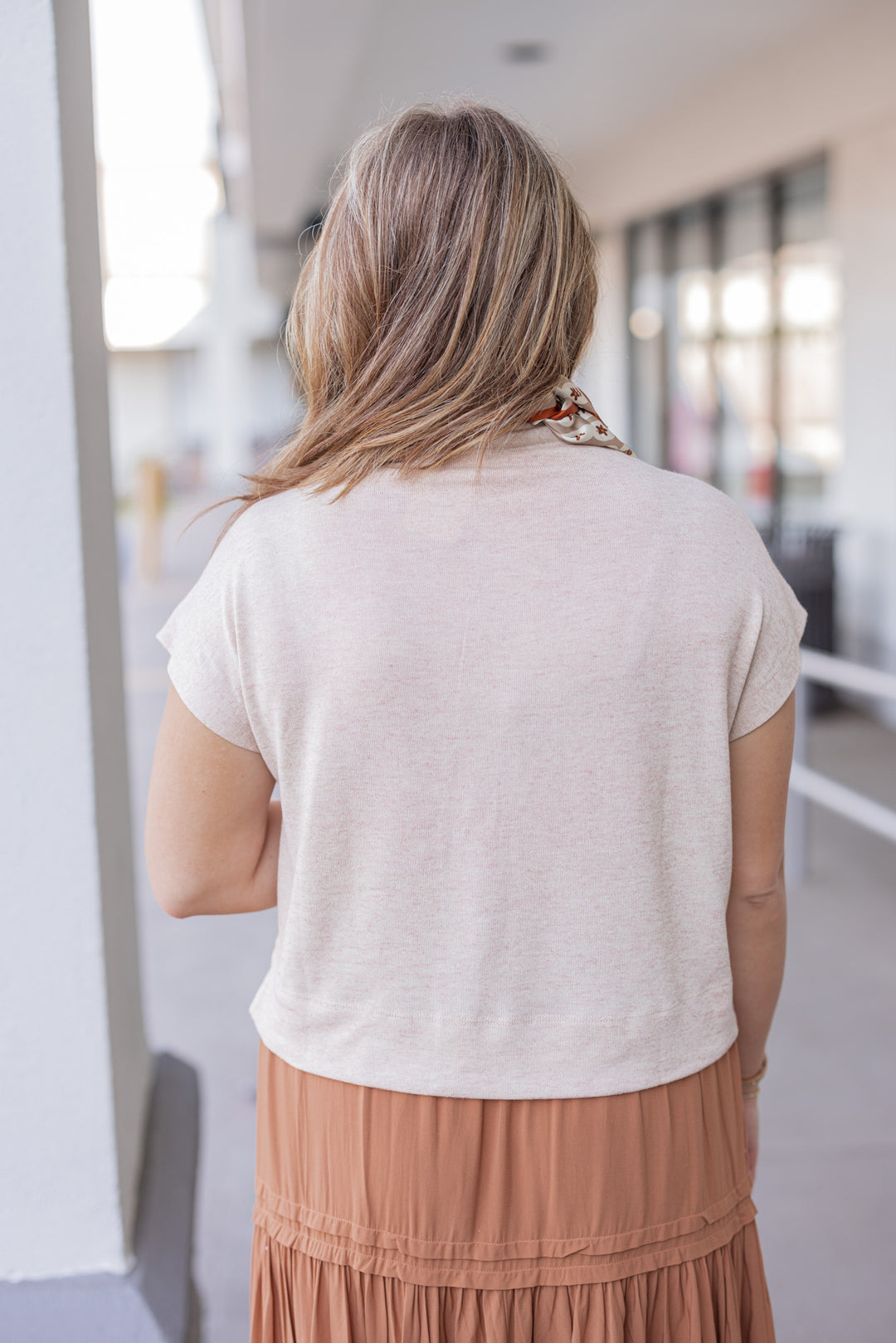 Women's oatmeal knit cropped top by Entro showing up close back view