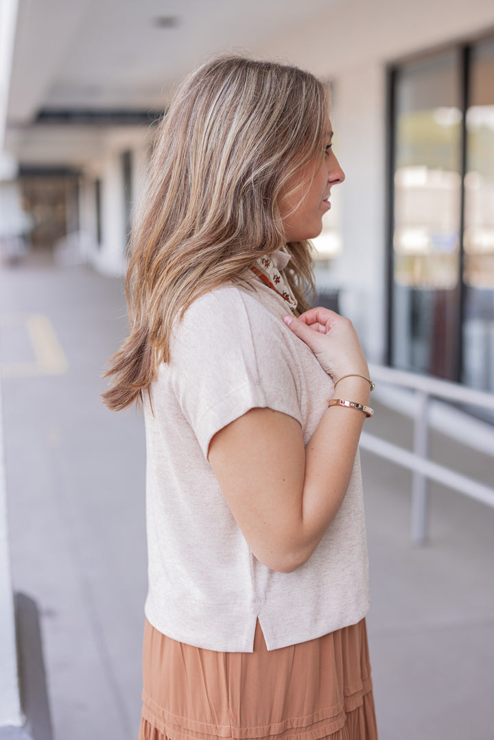 Women's oatmeal knit cropped top by Entro showing up close side view