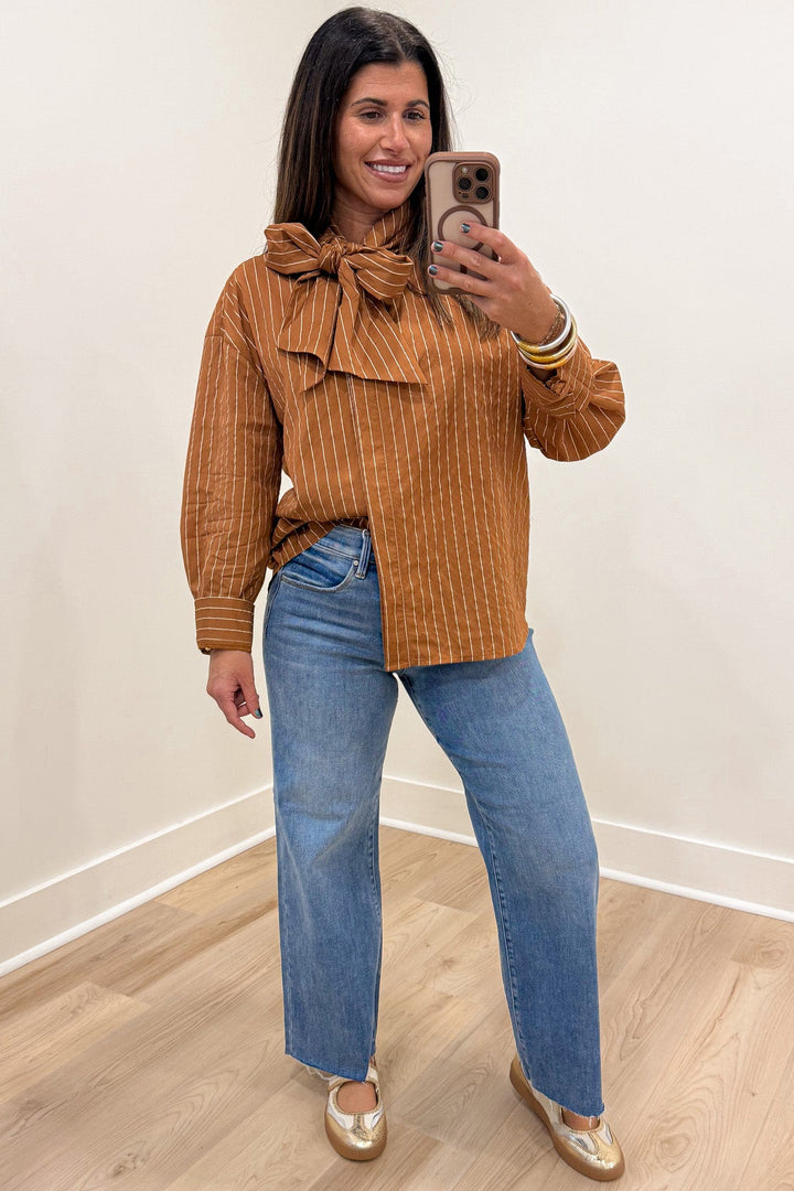 caramel and taupe striped mock neck cuffed long sleeve flap covered button front top