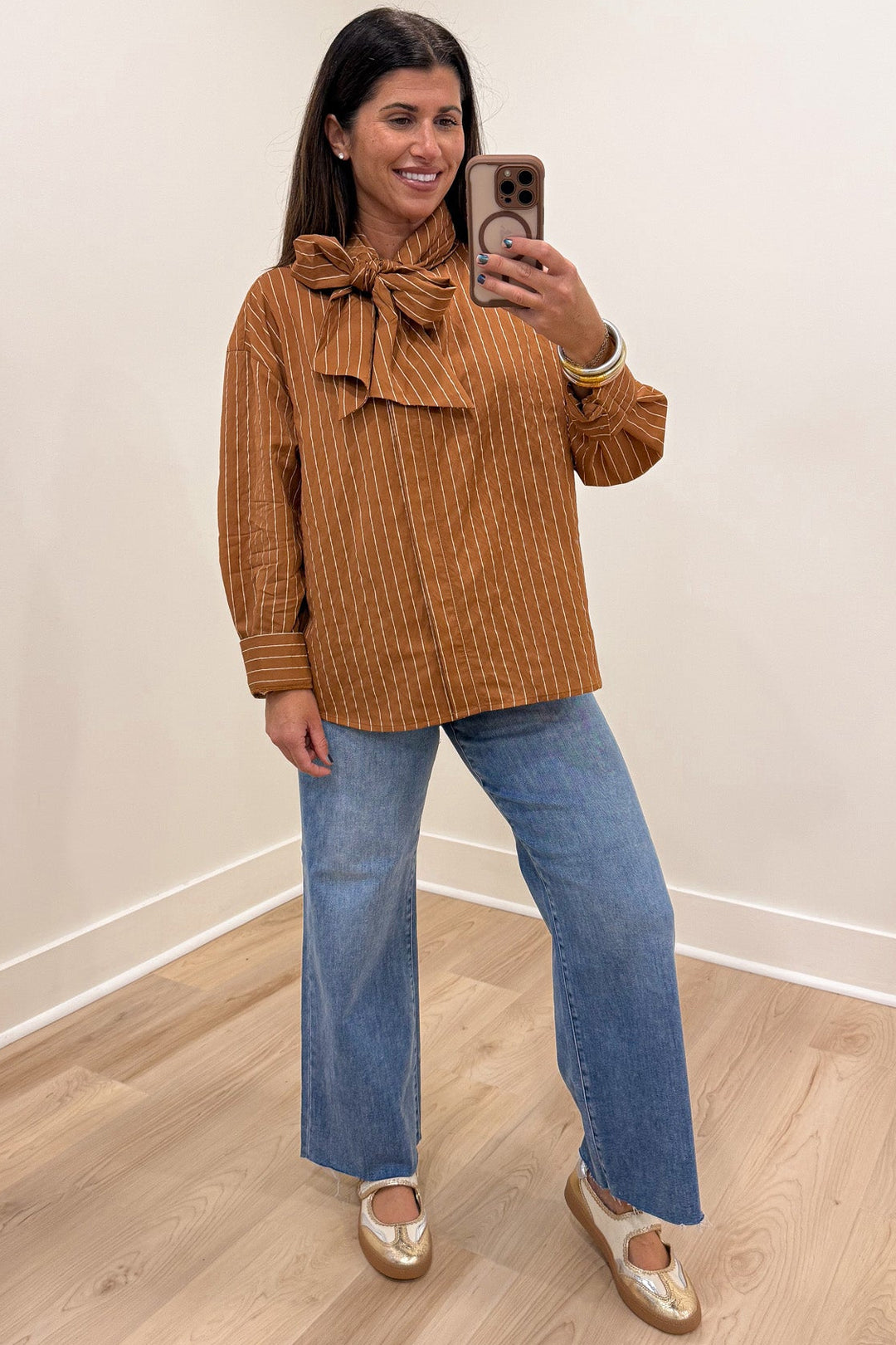 caramel and taupe striped bow tie mock neck long sleeve flap covered button front top