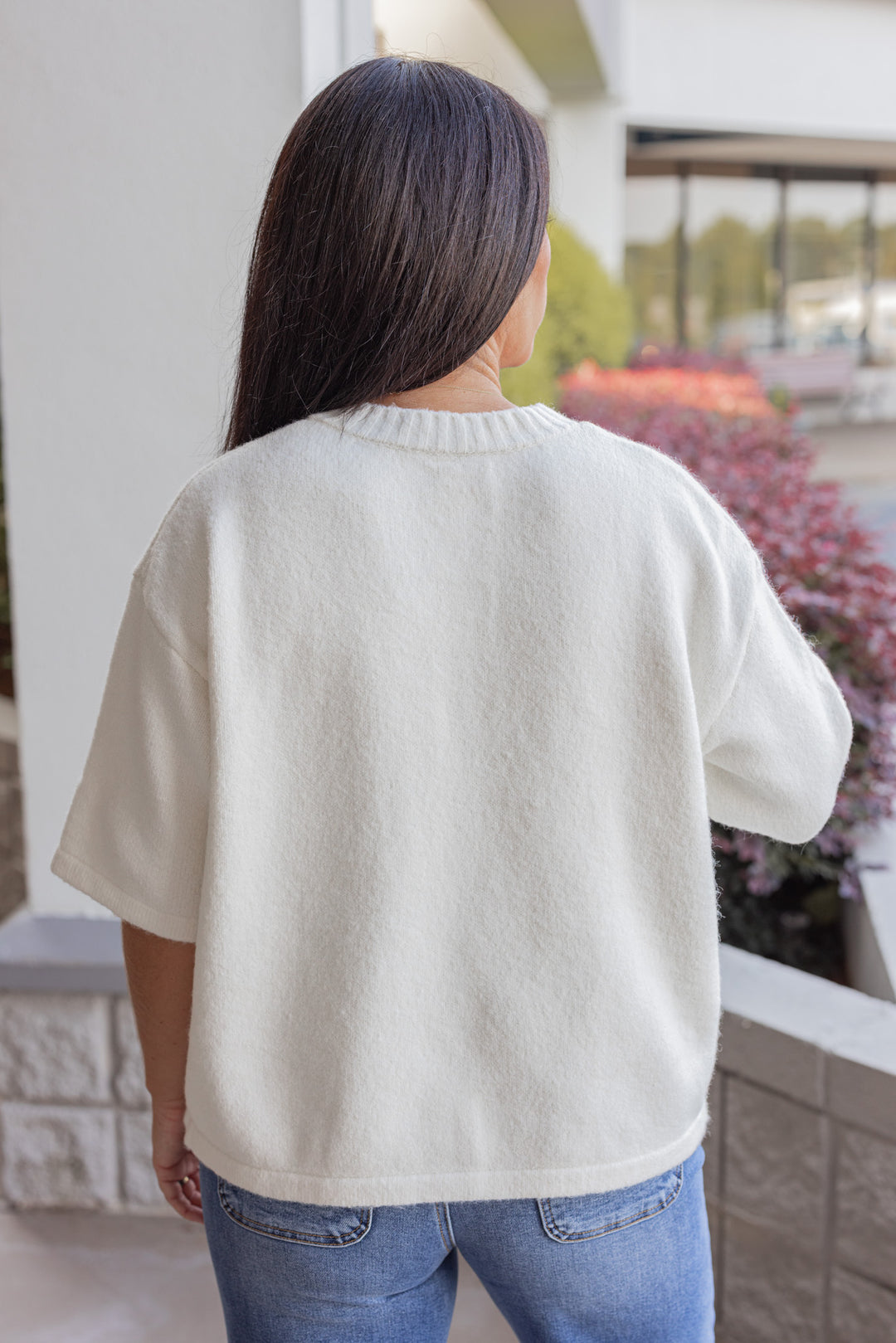 Women's off white brushed knit button front top by Wishlist showing up close back view