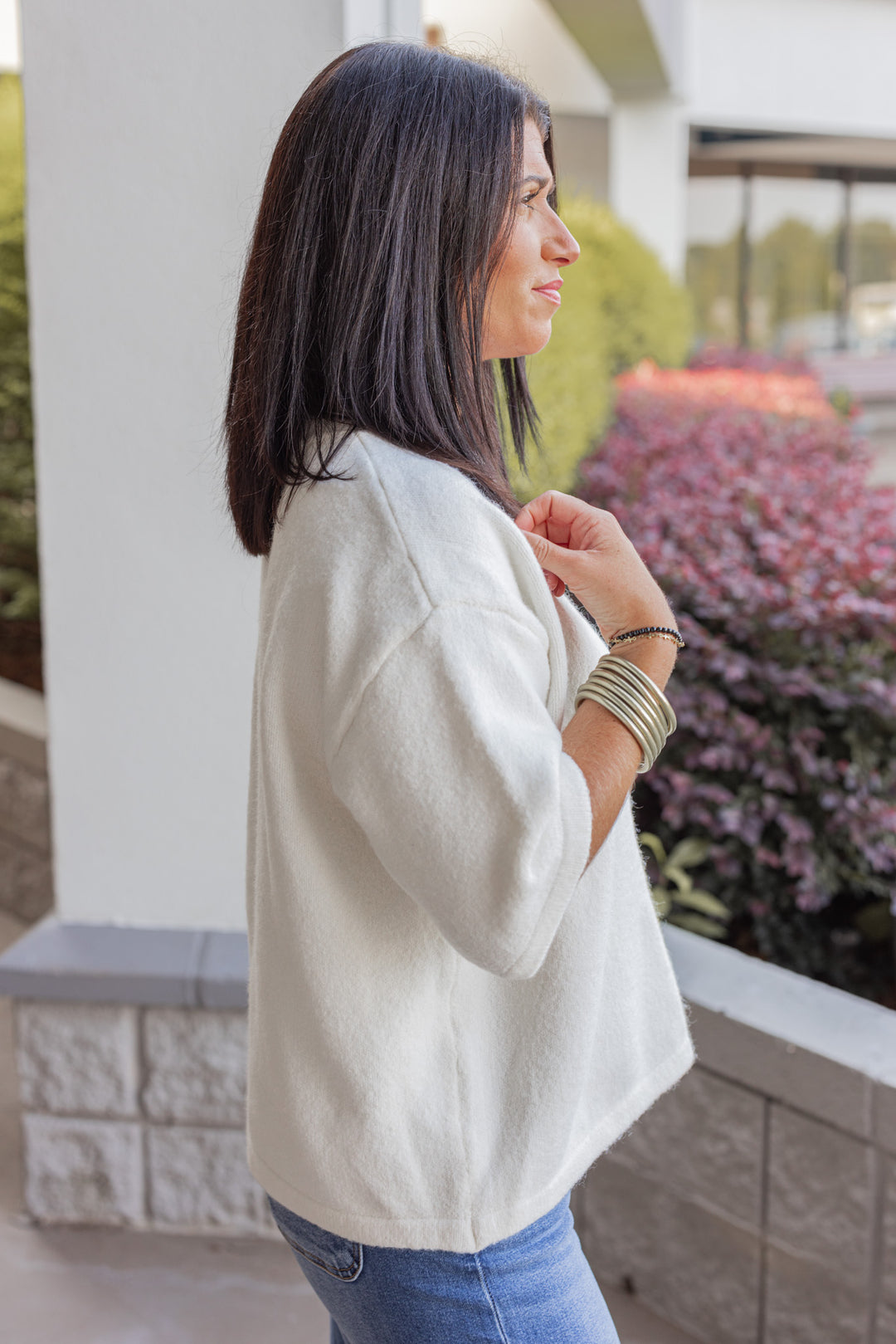 Women's off white brushed knit button front top by Wishlist showing up close side view