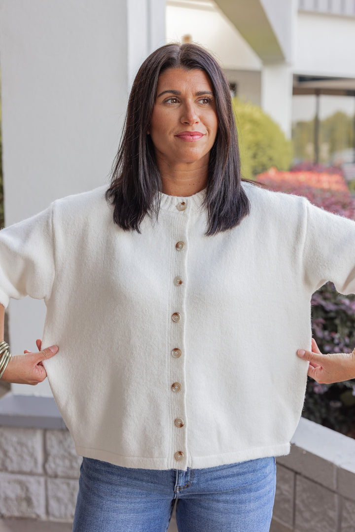 Women's off white brushed knit button front top by Wishlist showing true to size fit