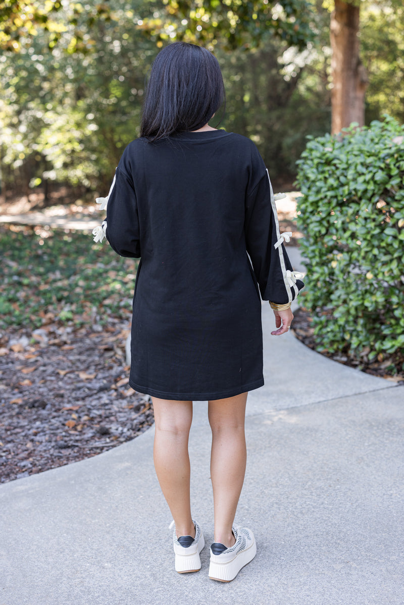 black sweatshirt dress with bow sleeves