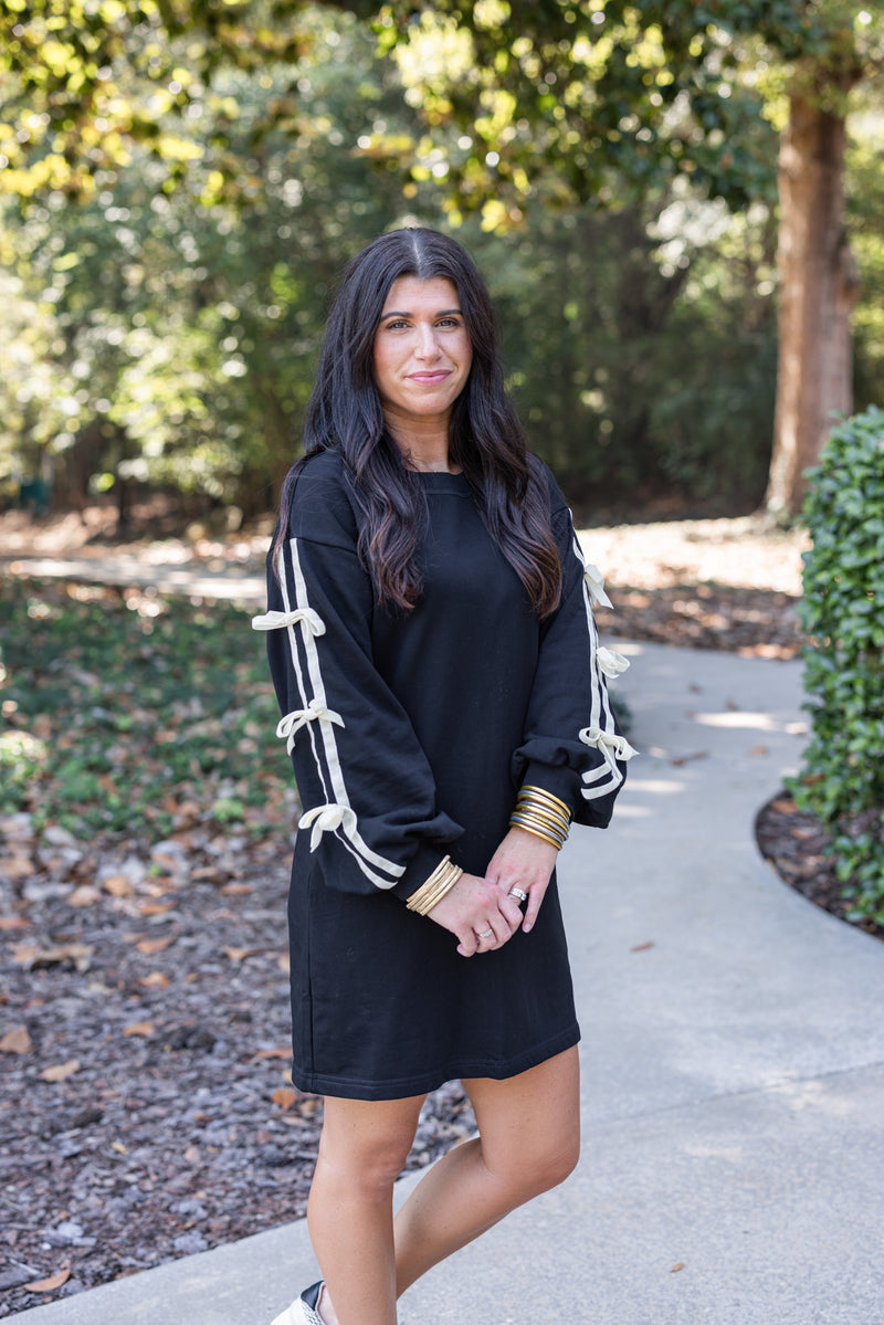 black sweatshirt dress with bow sleeves