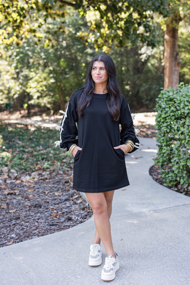 black sweatshirt dress with bow sleeves