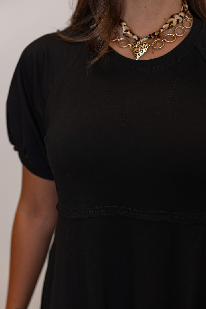 Black terry knit puff sleeve midi dress with raw seam details by Jodifl showing crew neckline and raw seam detailing