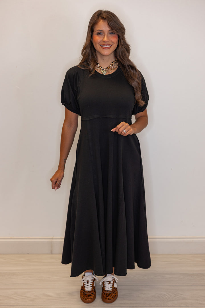 Black terry knit puff sleeve midi dress with raw seam details by Jodifl showing full front view