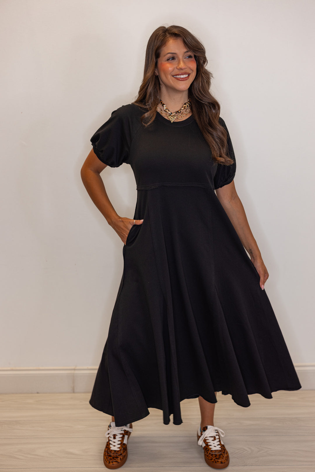 Black terry knit puff sleeve midi dress with raw seam details by Jodifl