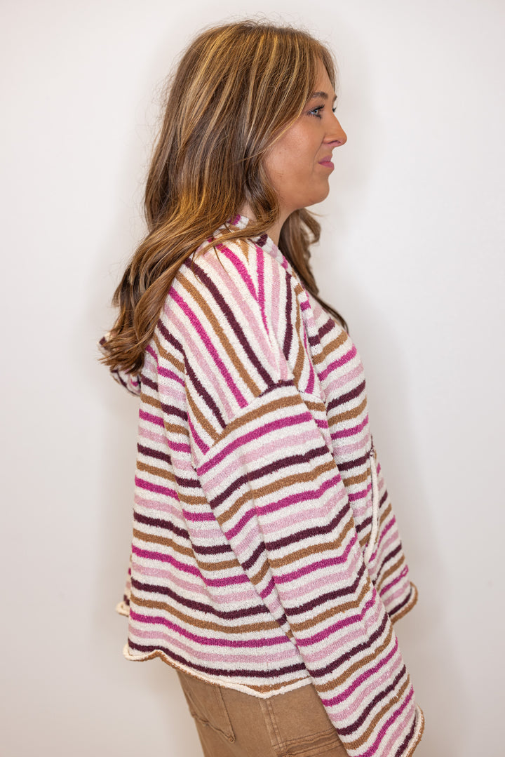 Women's pink and cream multicolor striped hooded knit sweater by Peach Love California showing up close side view