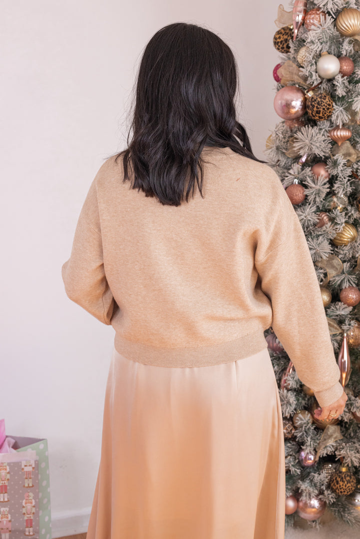 Women's champagne knit cropped sweater top with knotted detail at the hem by Jodifl showing up close back view