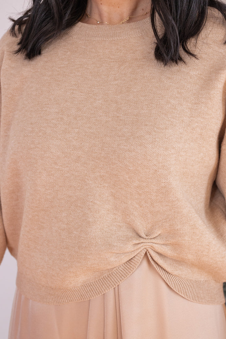 Women's champagne knit cropped sweater top with knotted detail at the hem by Jodifl showing knotted detail
