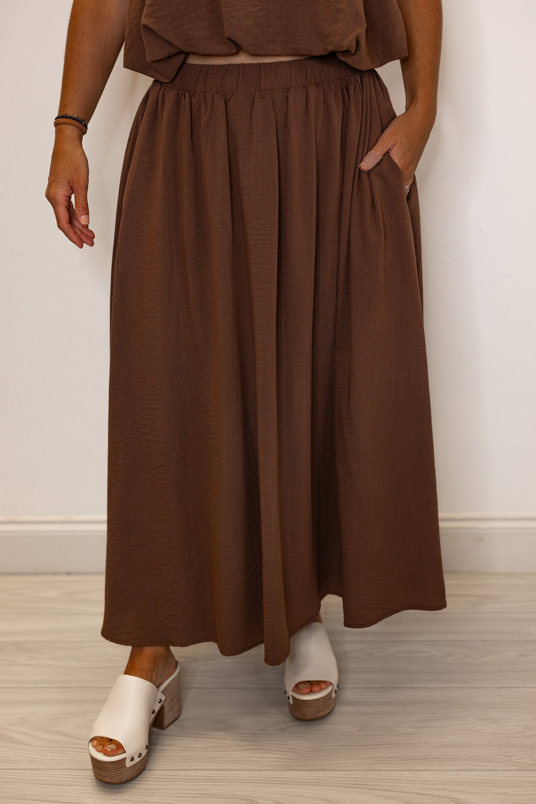 Women's espresso brown textured midi skirt with pleats by Entro