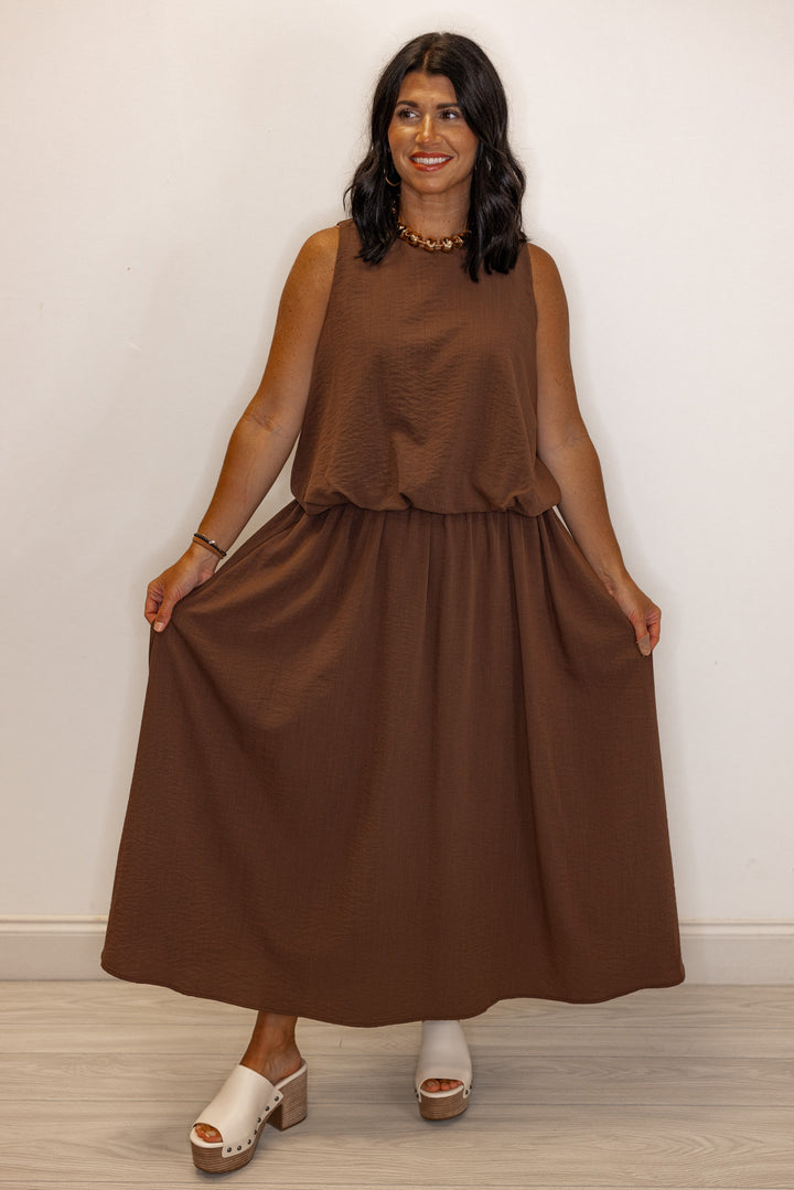 Women's espresso brown textured midi skirt with pleats by Entro showing relaxed silouhette
