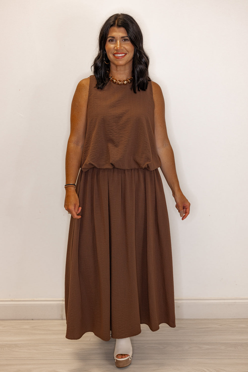 Espresso brown textured bubble hem sleeveless crop top by Entro showing full front view