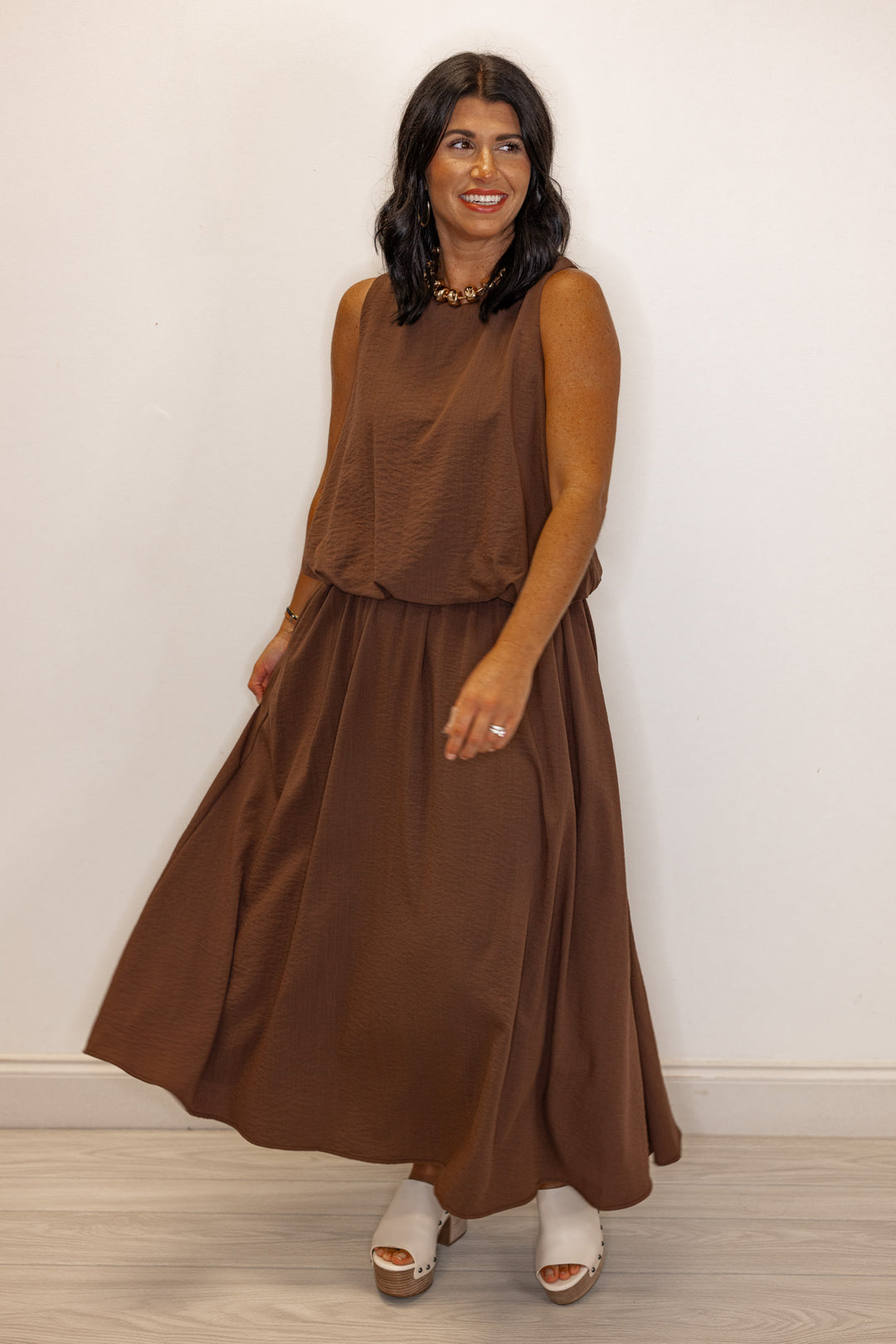 Espresso brown textured bubble hem sleeveless crop top by Entro shown with  matching skirt