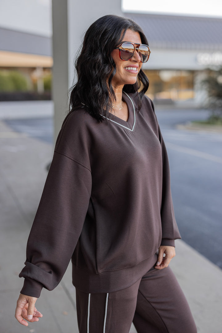 Women's chocolate brown scuba knit top by Rae Mode showing up close side view