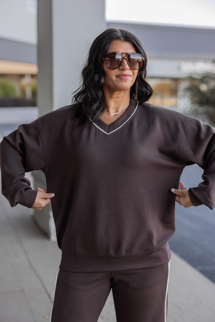 Women's chocolate brown scuba knit top by Rae Mode showing true to size fit