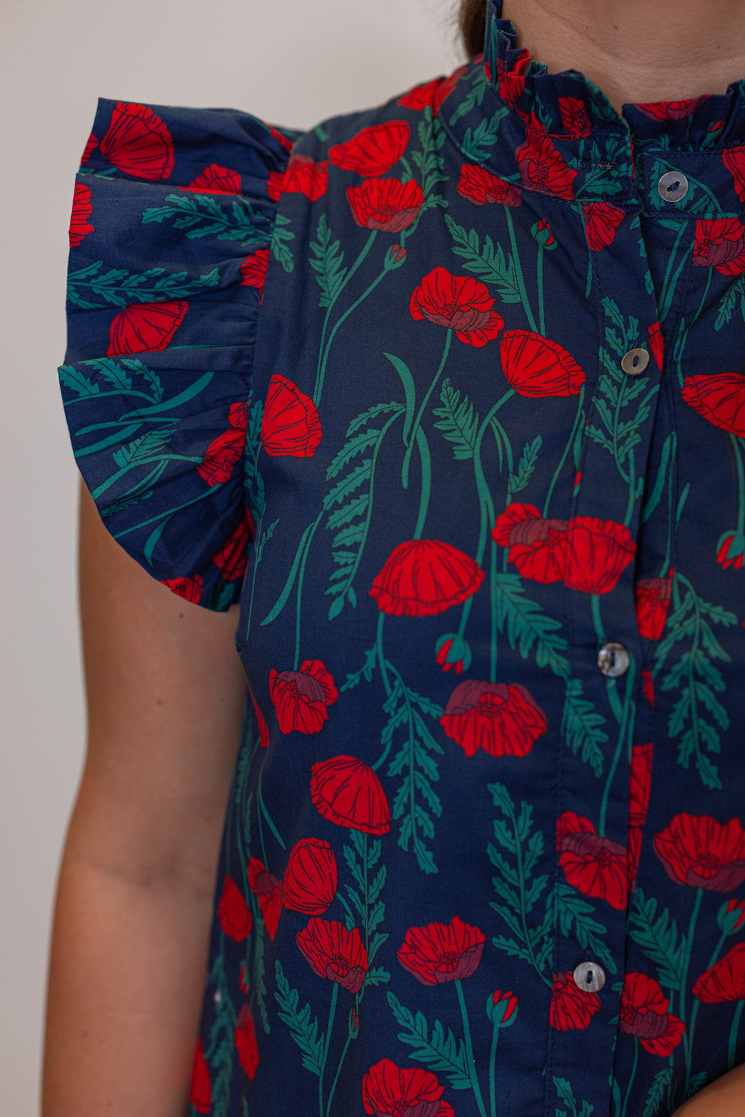 Womens navy blue button front midi dress with red floral print by Entro showing up close view of floral pattern